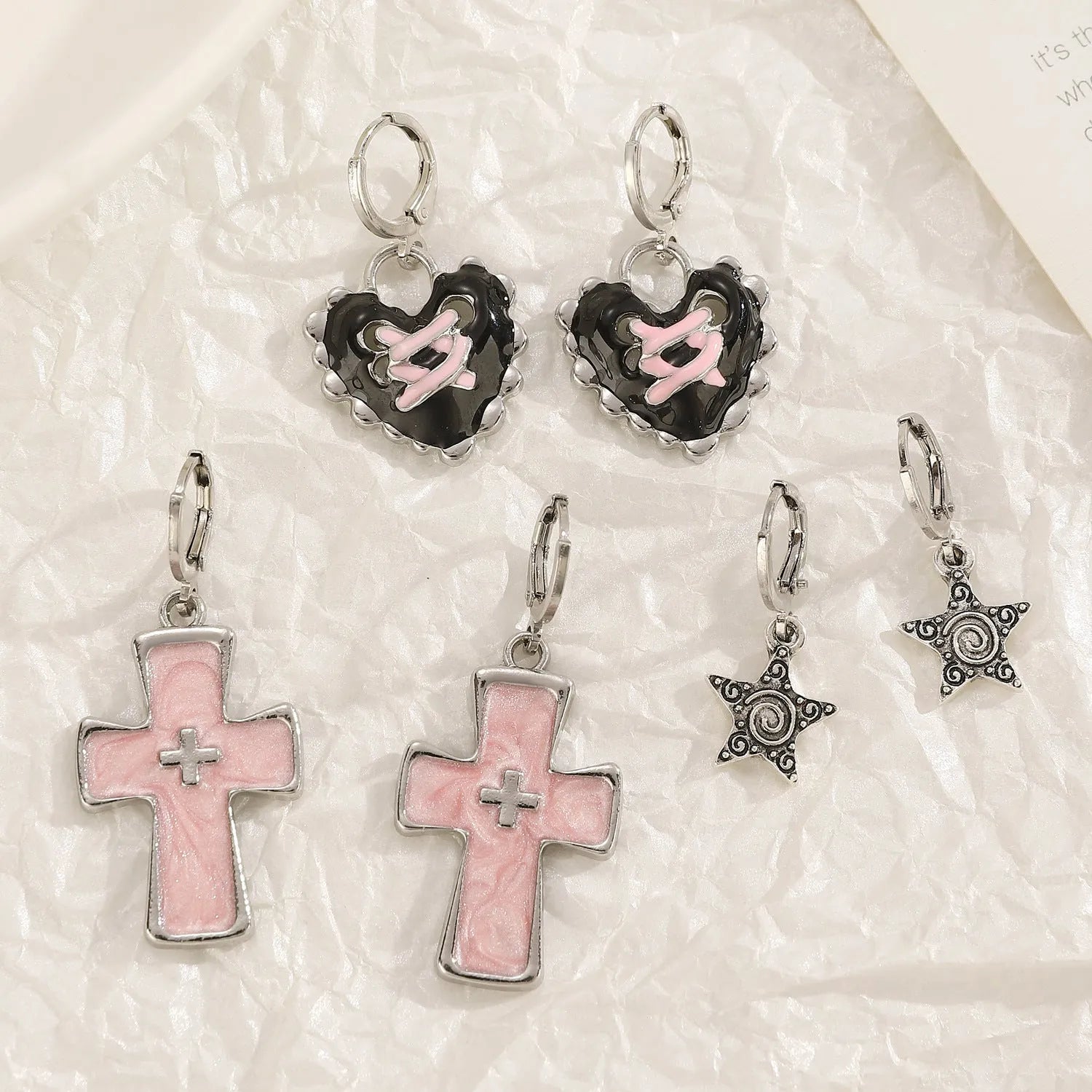Women's alloy earrings in cross, heart and animal designs with multiple colour options