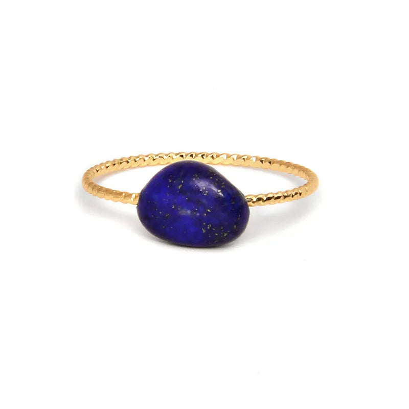 Geometric shaped agate ring for women on a hand, showing original design and coloured stone.