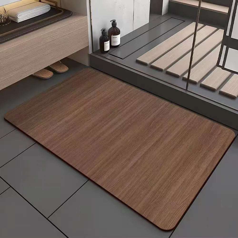 Square diatom mud bathroom floor mat with a brown wood grain geometric pattern on a tiled floor.