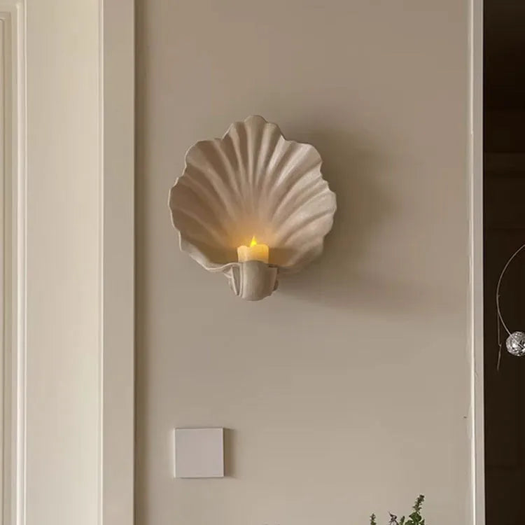 White resin simulation shell fruit plate ornament on a table