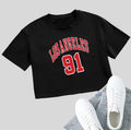 Women's black cotton t-shirt with white printed English letters, loose fit, short sleeves, and exposed navel design.