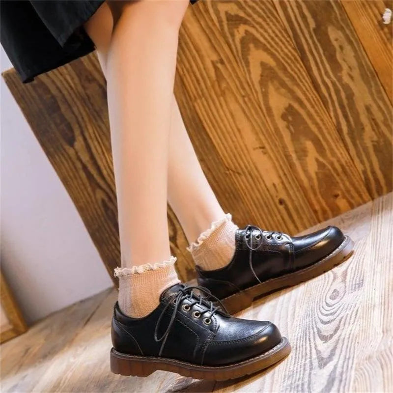 Women's black retro Mary Jane pumps with square heel and front lace-up closure