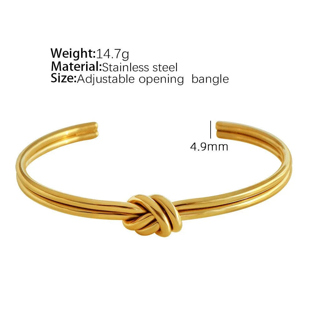 Women's stainless steel bracelet with knotted C-shaped open design in gold plating