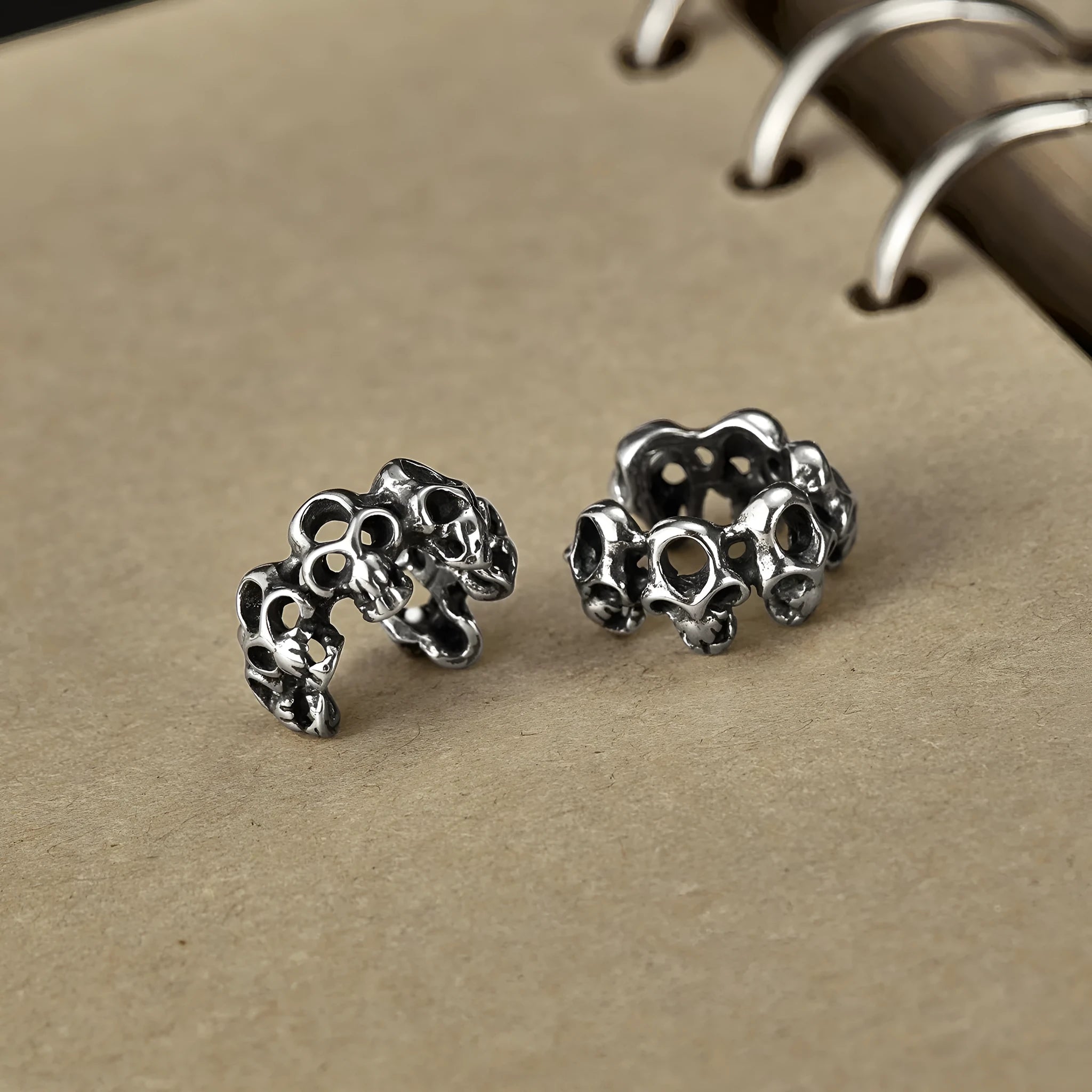 Retro geometric hollow skull earrings with steel clip, stainless steel construction with electroplated finish