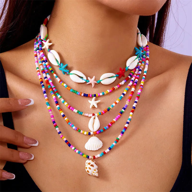 Multi-layer women's necklace with starfish shell pendants on adjustable bead chain