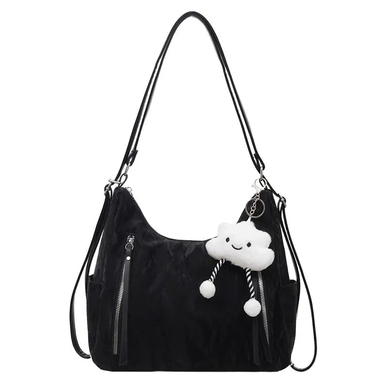 Women's soft black PU fashion backpack with adjustable straps and a silver pendant.