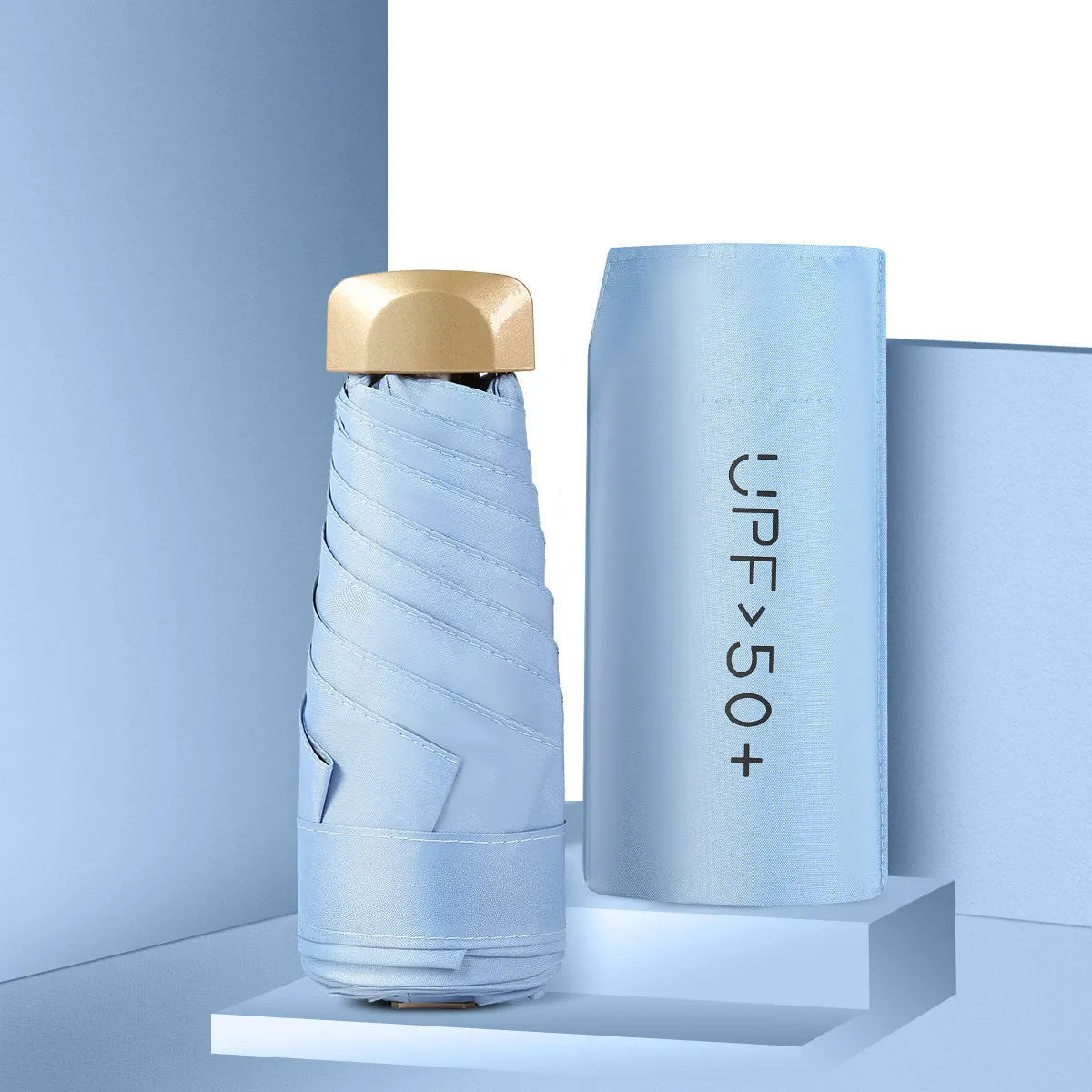 Closed five-fold mini pocket sun umbrella showing compact size and rubber handle