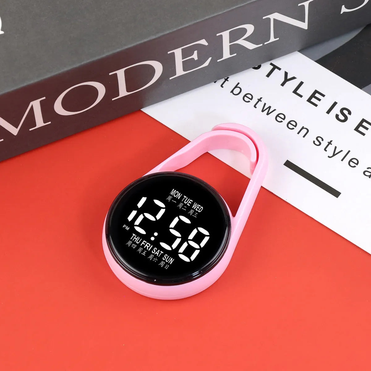 LED digital wristwatch showing time and week day on display, with plastic strap.