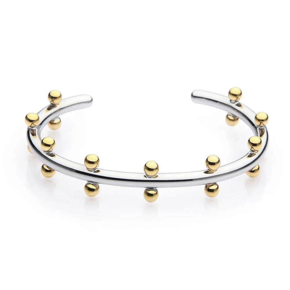 Stainless steel bracelet with C-shaped bean bead charm featuring texture and rivet details.