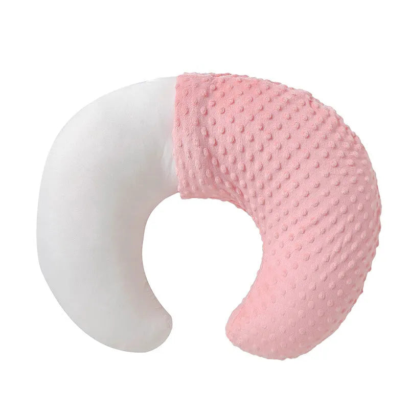Multifunctional nursing pillow with a removable cover in grey, designed for feeding support and spill prevention.