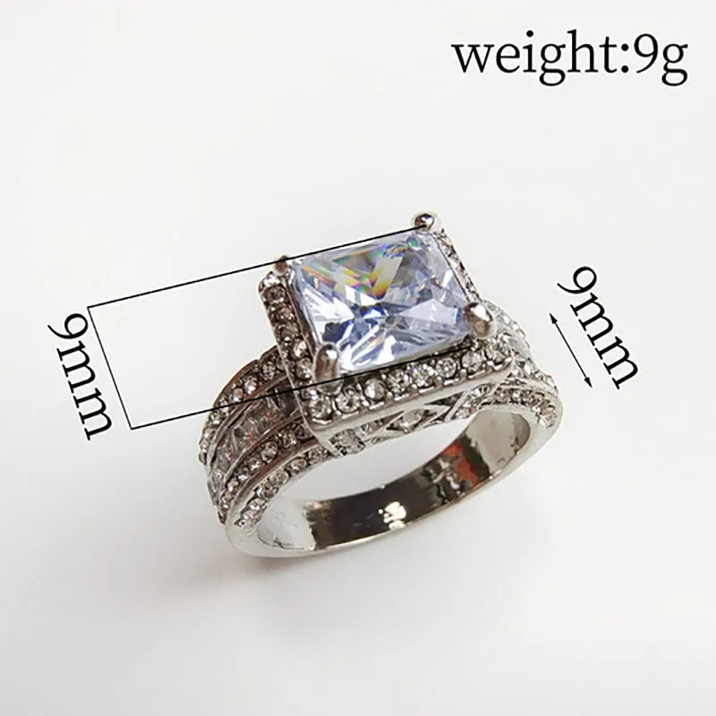 Women's geometric alloy ring with electroplated gold or white finish and round decorative elements