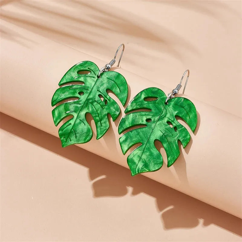 Acrylic drop shape earrings with a coconut design in one of five colour styles on alloy hooks.