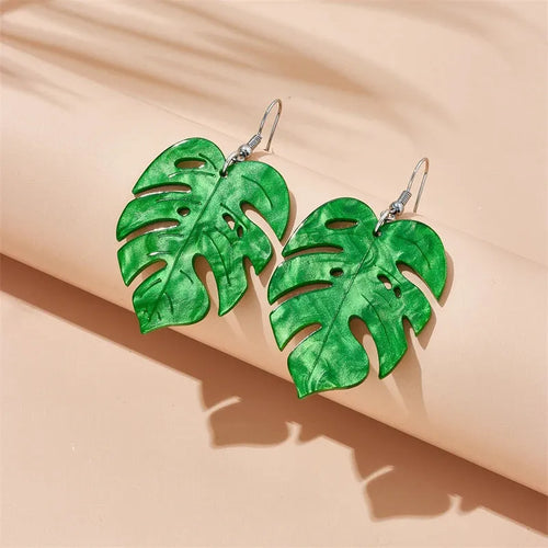 Acrylic drop shape earrings with a coconut design in one of five colour styles on alloy hooks.