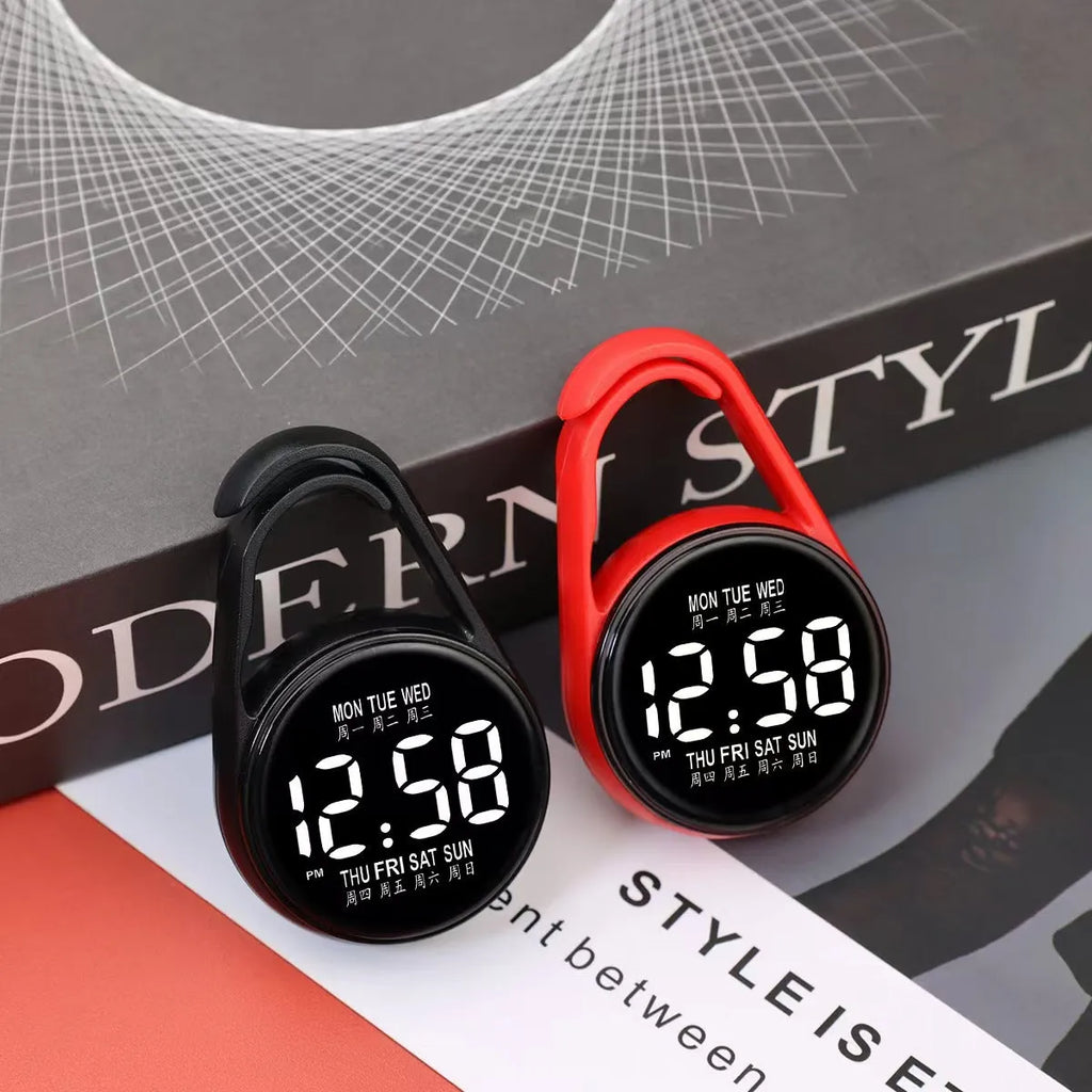 LED digital wristwatch showing time and week day on display, with plastic strap.