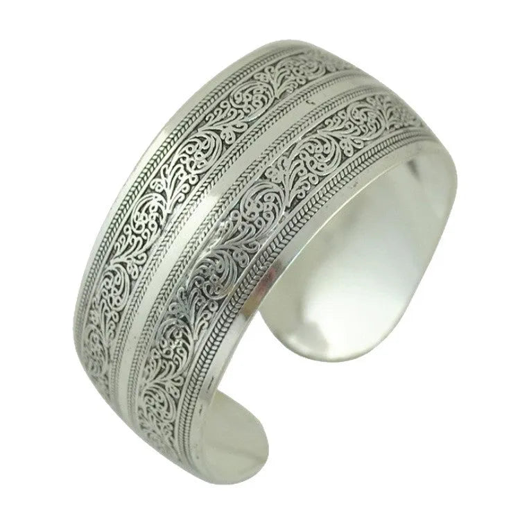 Silver Miao ethnic carved open bracelet with elephant motif on alloy metal