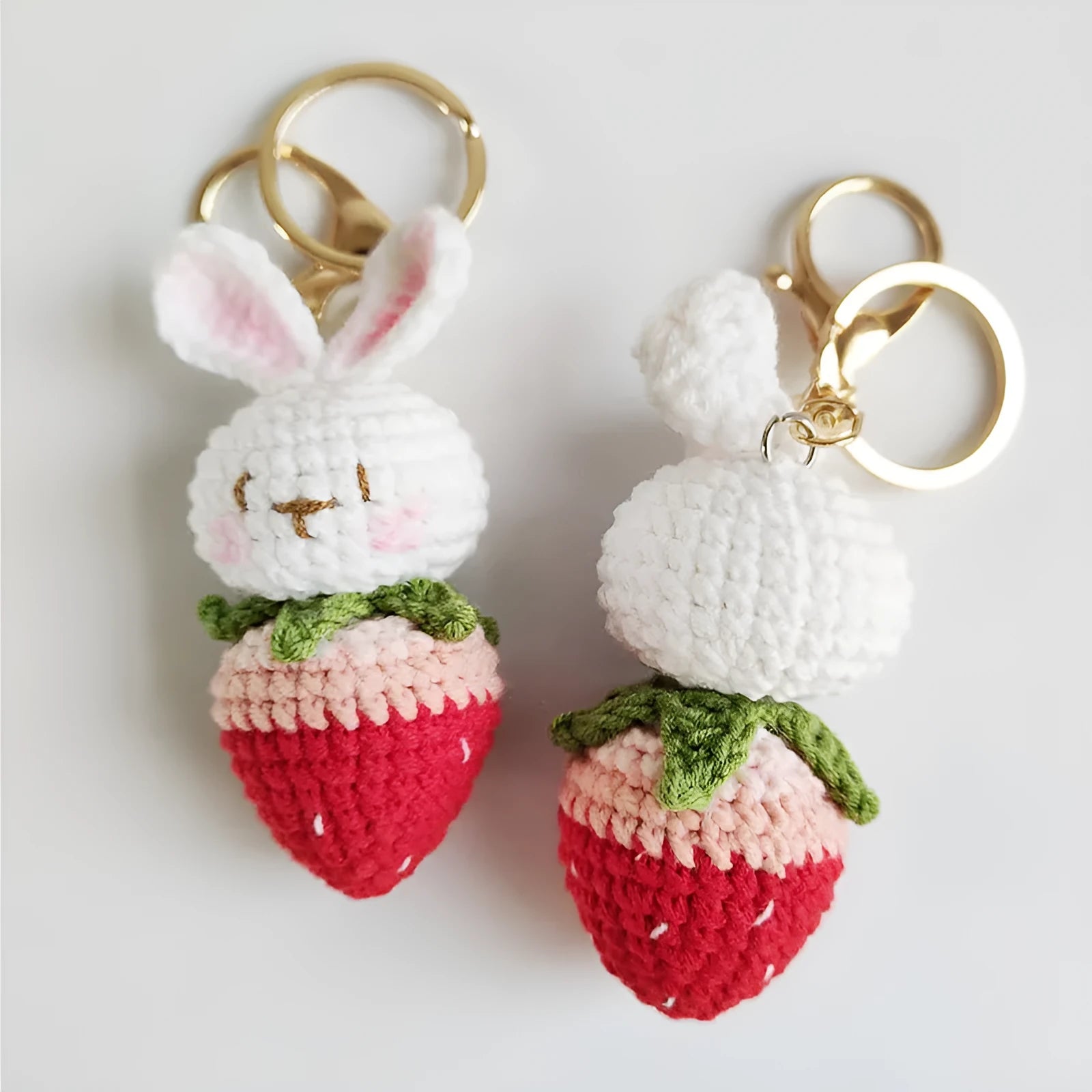 Hand-woven white wire rabbit pendant with strawberry motif and attached key