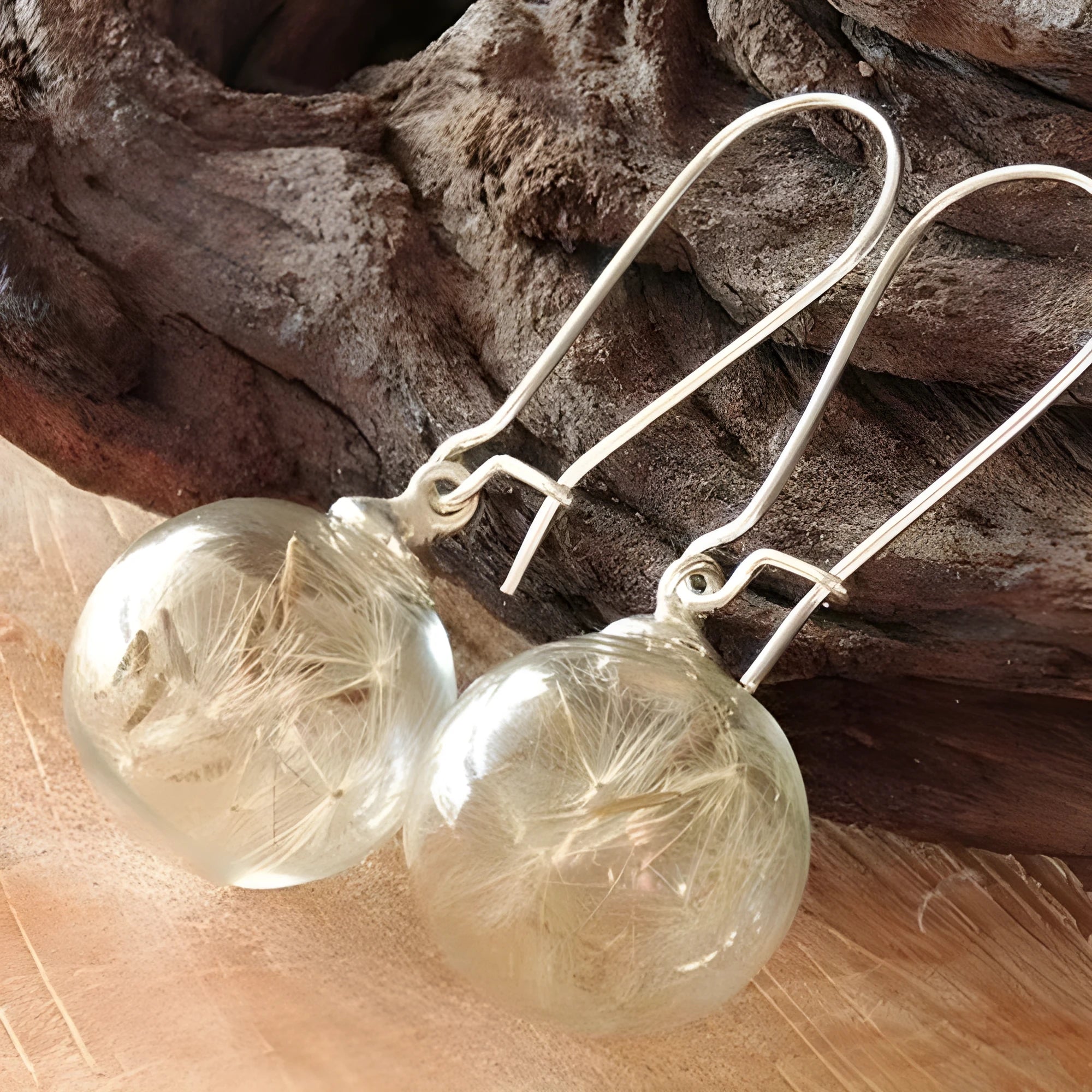Transparent glass ball earrings with dandelion design and French hook options in silver and bronze finishes