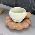 Ceramic coffee set with a 250ml cup and matching dish in a simple solid colour design.