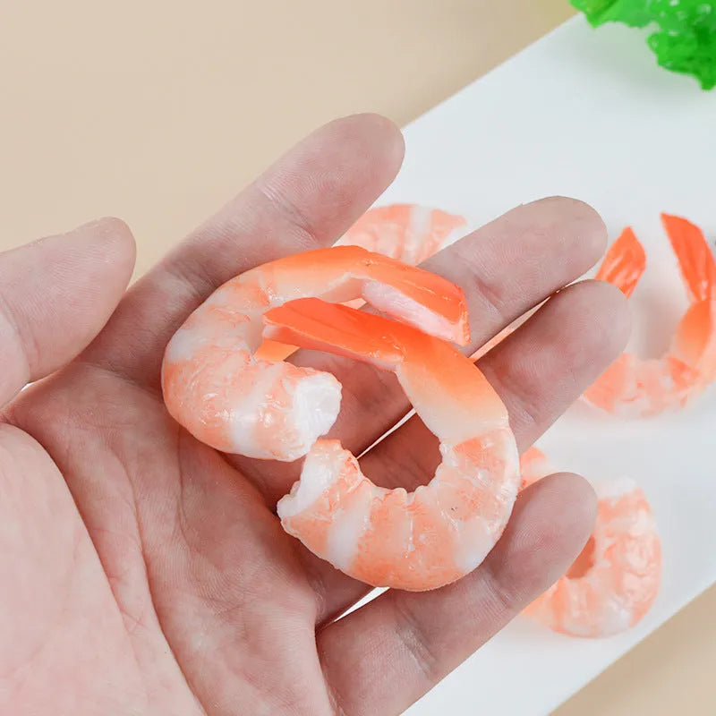 Close-up of a white simulation shrimp PVC keychain pendant showing its 1.5cm thickness.