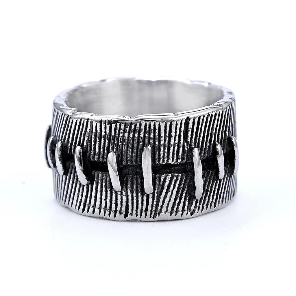 Geometric U-shaped titanium steel punk ring with double-ring design and stitched texture in black.