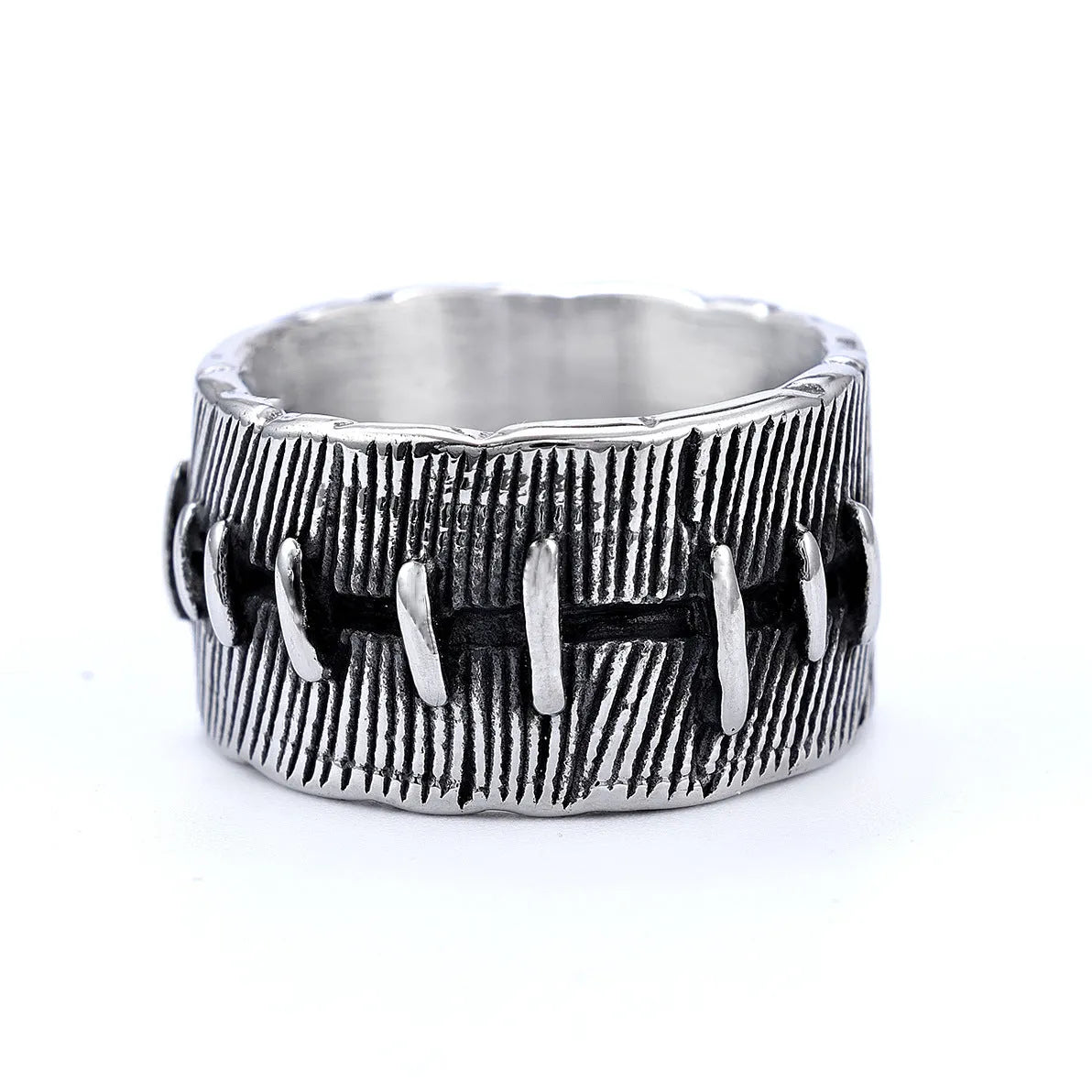 Geometric U-shaped titanium steel punk ring with double-ring design and stitched texture in black.