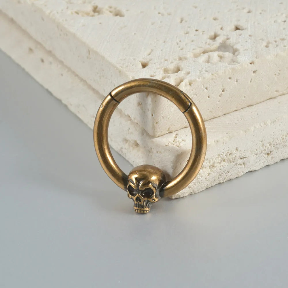 Punk copper earrings with antique ghost head designs in gold and silver finishes