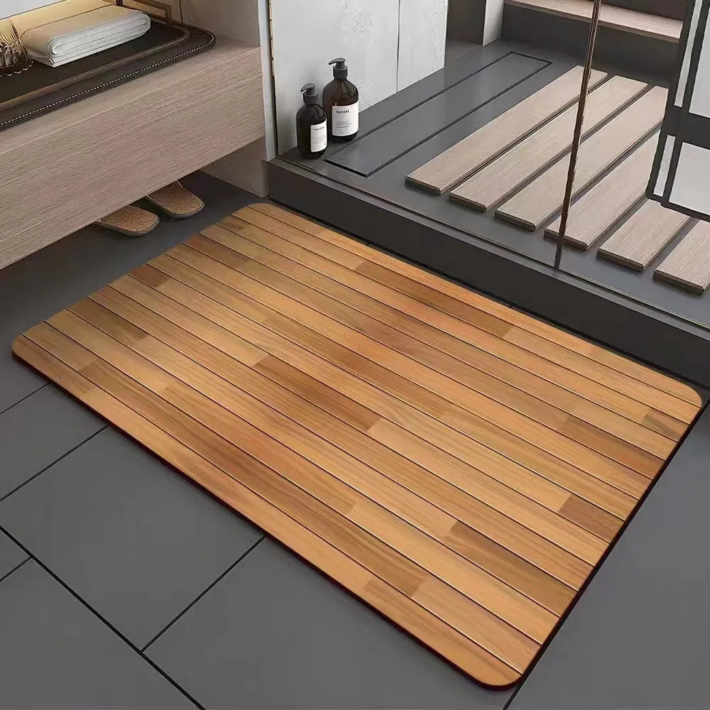 Square diatom mud bathroom floor mat with a brown wood grain geometric pattern on a tiled floor.