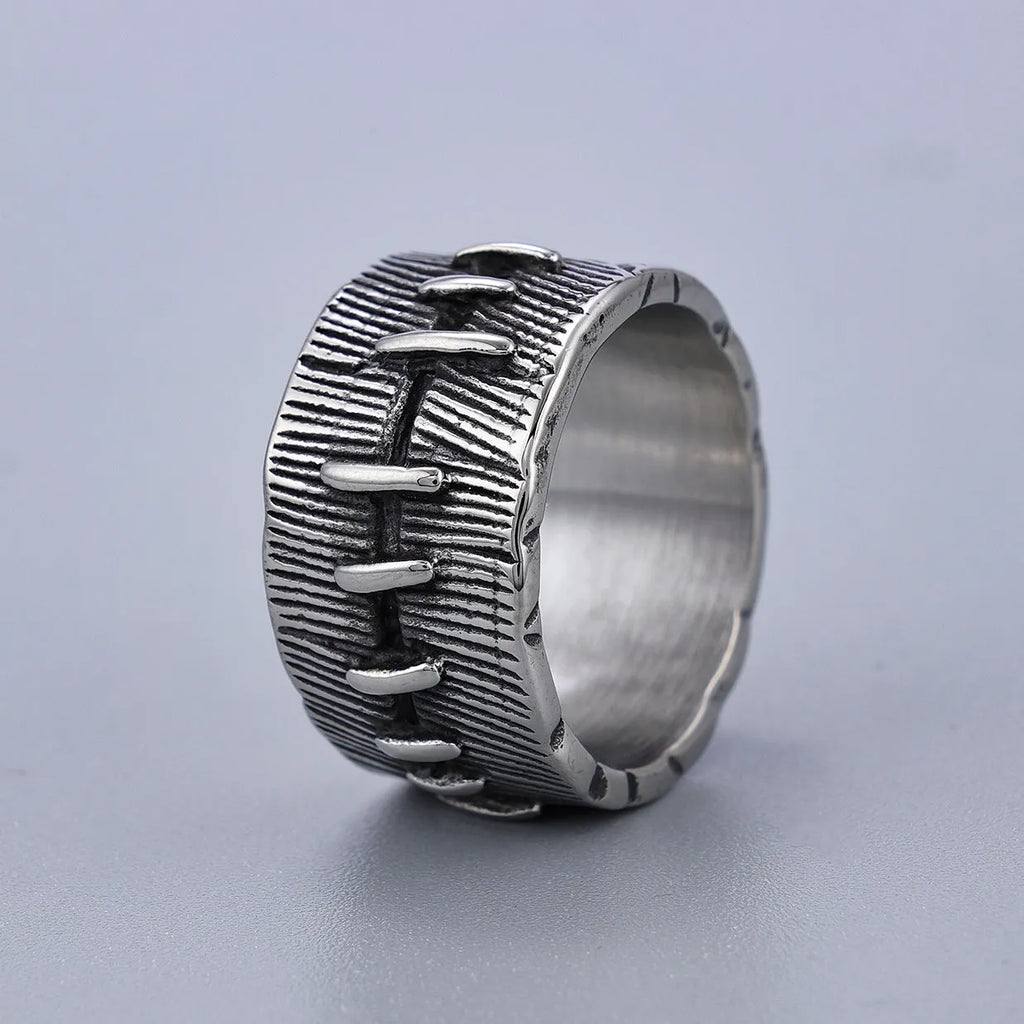 Geometric U-shaped titanium steel punk ring with double-ring design and stitched texture in black.