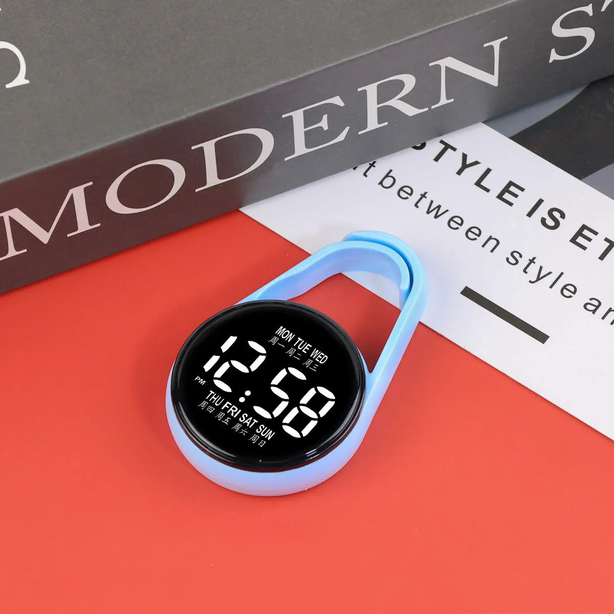 LED digital wristwatch showing time and week day on display, with plastic strap.