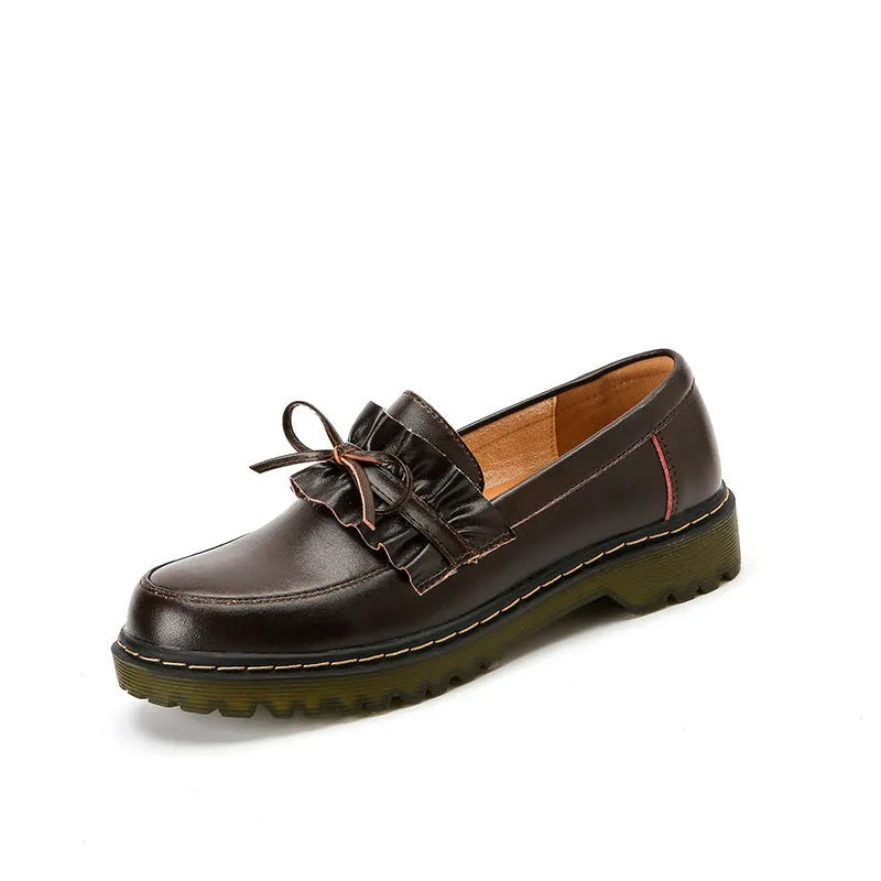 Women's black round-toe leather shoes with a chunky flat heel and lace-up front.