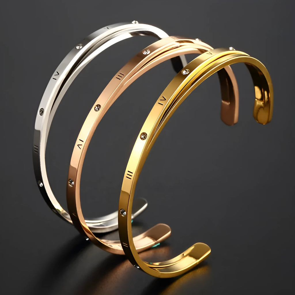Open-ended women's bracelet in stainless steel with electroplated finish and inlaid zircon stones.