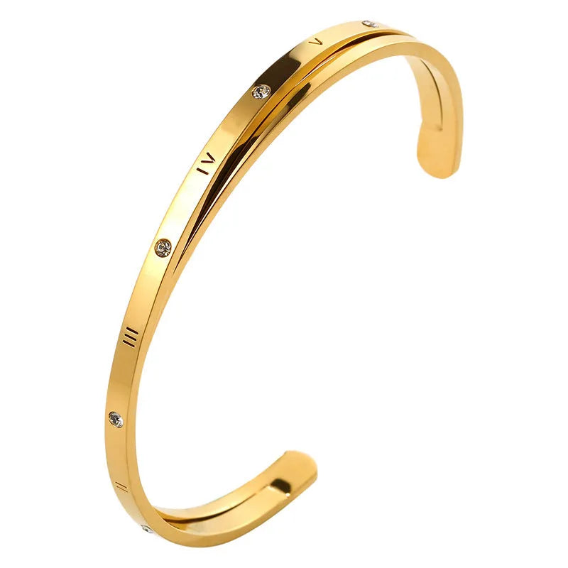 Open-ended women's bracelet in stainless steel with electroplated finish and inlaid zircon stones.