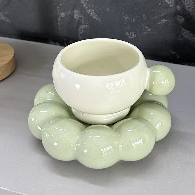 Ceramic coffee set with a 250ml cup and matching dish in a simple solid colour design.