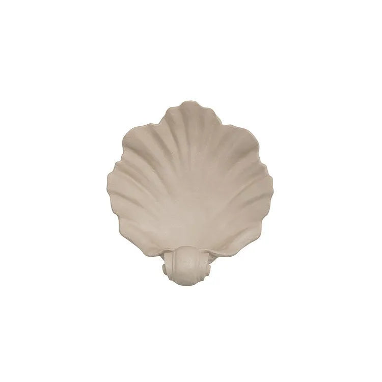 White resin simulation shell fruit plate ornament on a table