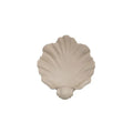 White resin simulation shell fruit plate ornament on a table