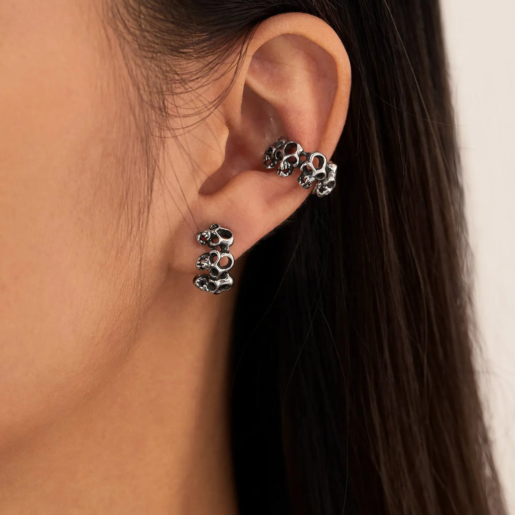 Retro geometric hollow skull earrings with steel clip, stainless steel construction with electroplated finish
