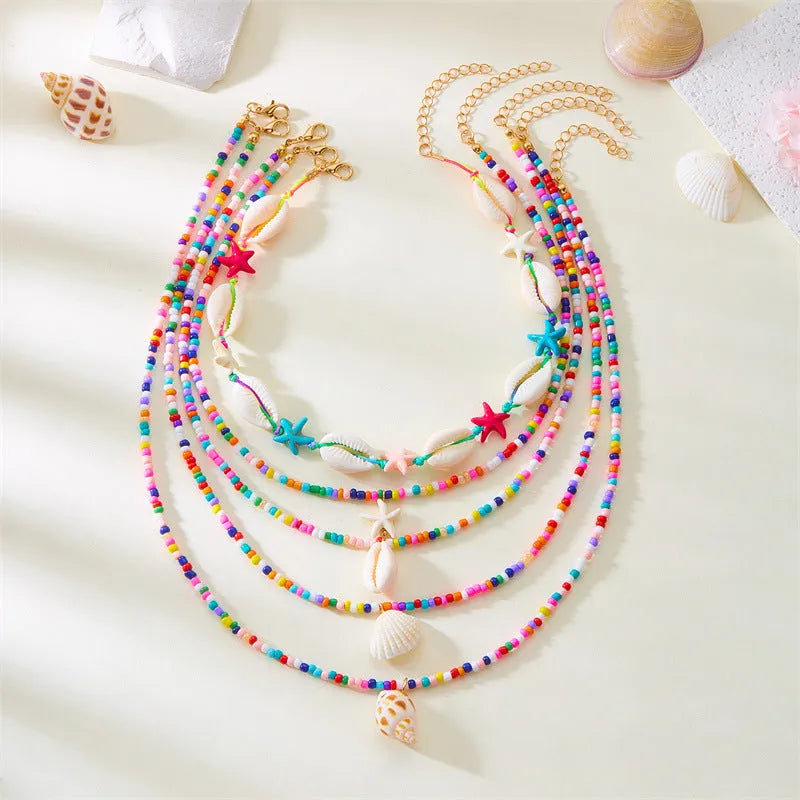 Multi-layer women's necklace with starfish shell pendants on adjustable bead chain