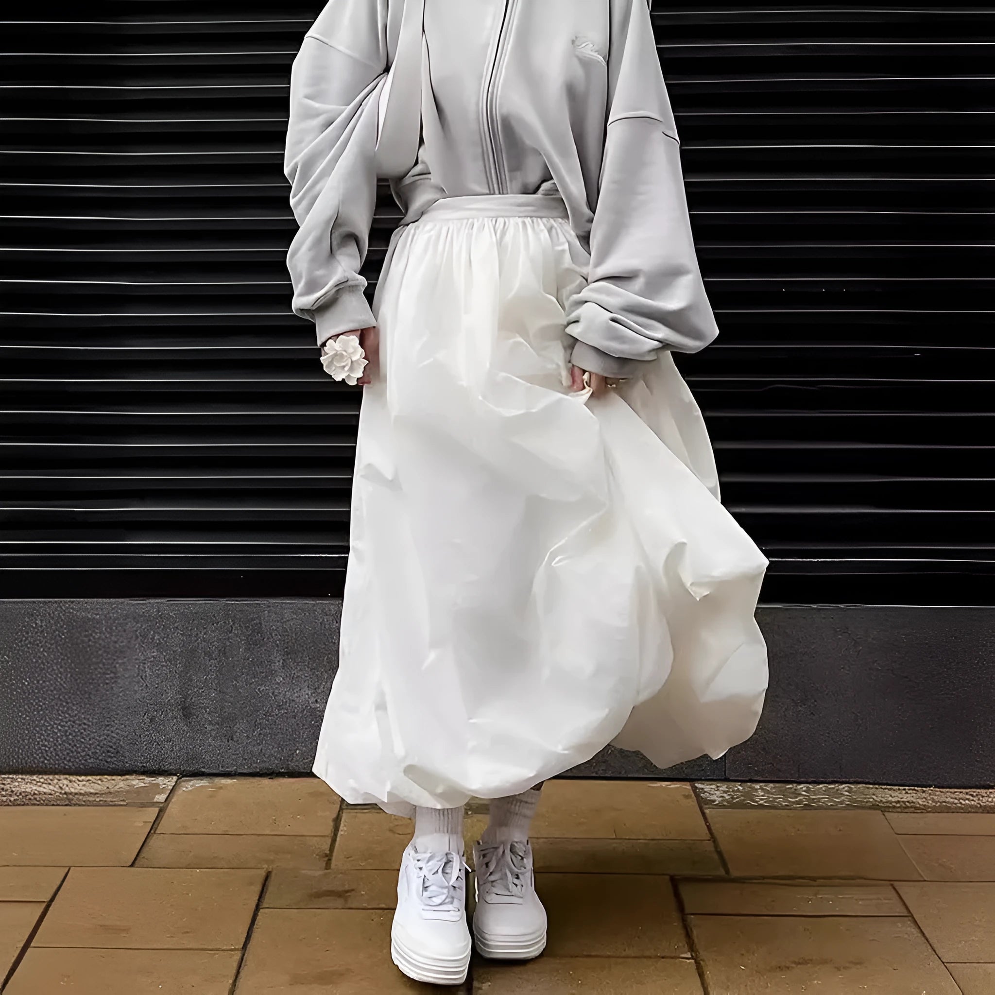 Women's solid colour cotton midi skirt in black or white showing long length