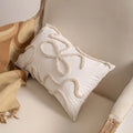 Knitted cushion cover with tassel trim in a striped pattern, shown in a choice of colours including spiral dots and woven rabbit fur.