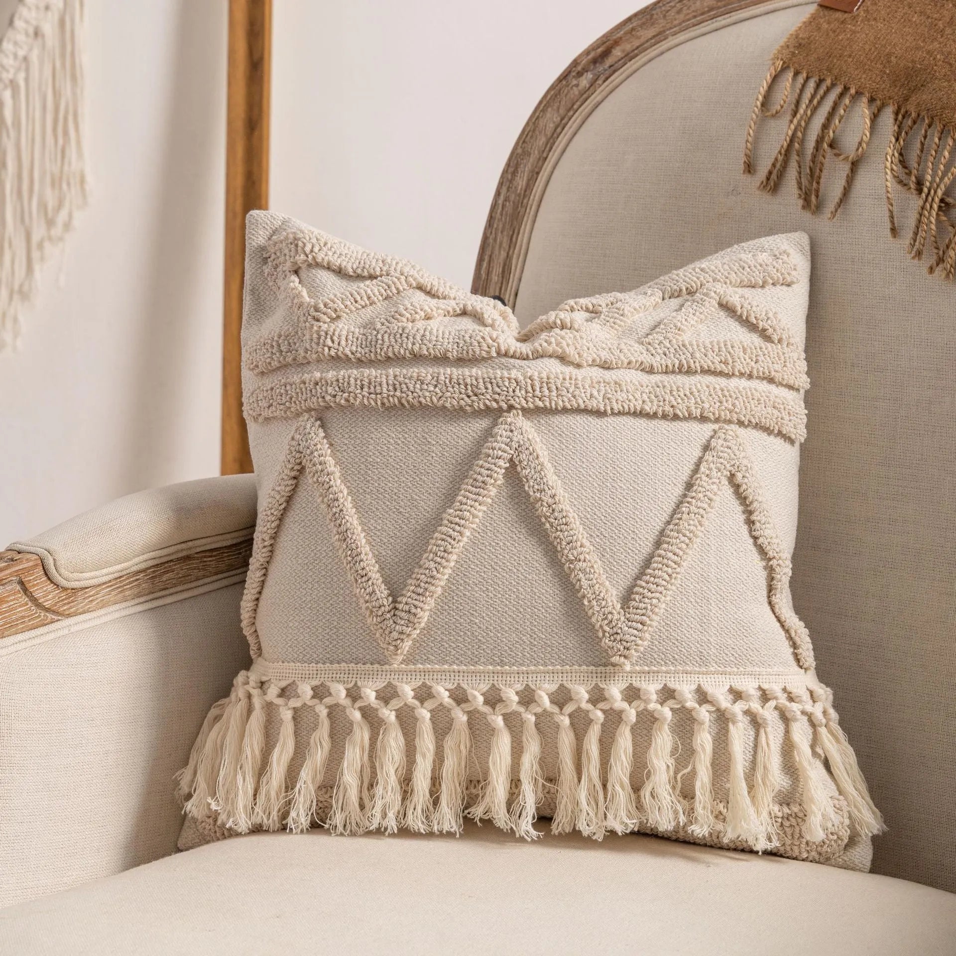 Knitted cushion cover with tassel trim in a striped pattern, shown in a choice of colours including spiral dots and woven rabbit fur.