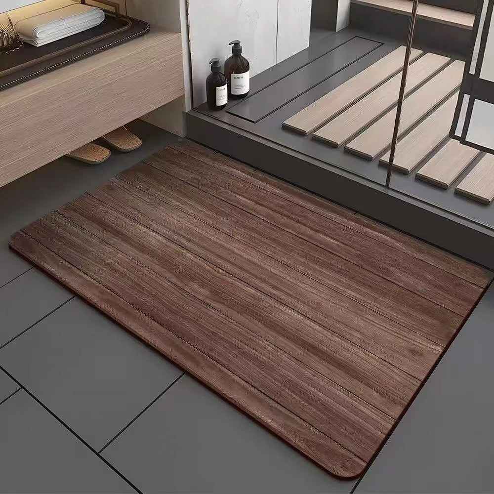 Square diatom mud bathroom floor mat with a brown wood grain geometric pattern on a tiled floor.