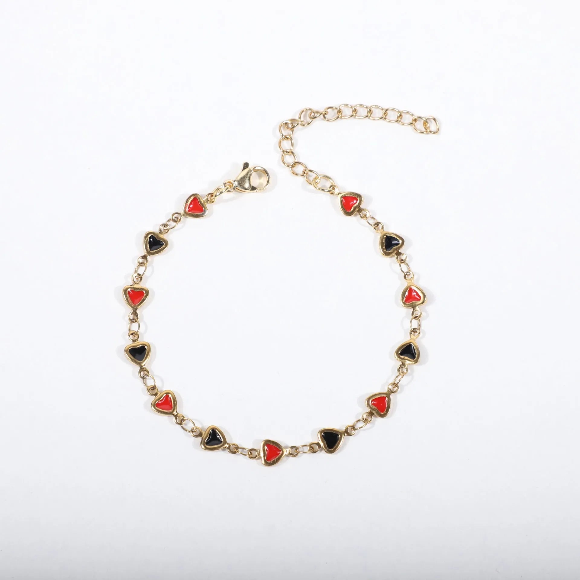 Adjustable stainless steel heart bracelet with 18K gold plating in multiple colour options showing length adjustment