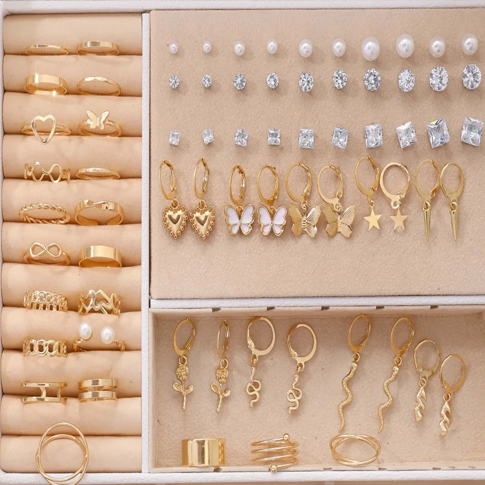 108 gold and yellow geometric alloy pearl earrings arranged in a set.