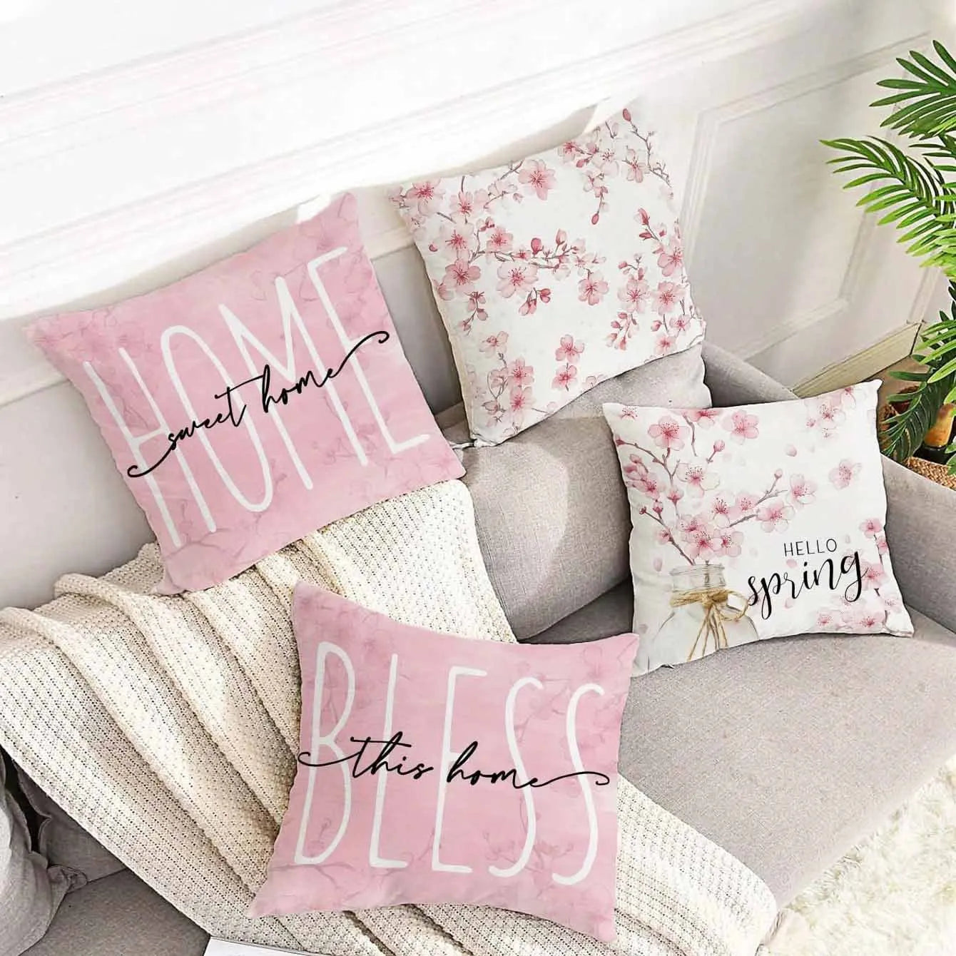 Square cherry blossom letter patterned cushion cover on a sofa, short velvet fabric.