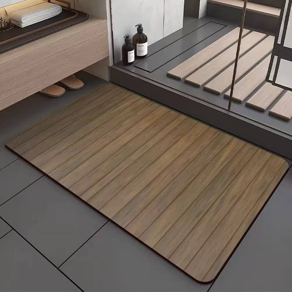 Square diatom mud bathroom floor mat with a brown wood grain geometric pattern on a tiled floor.
