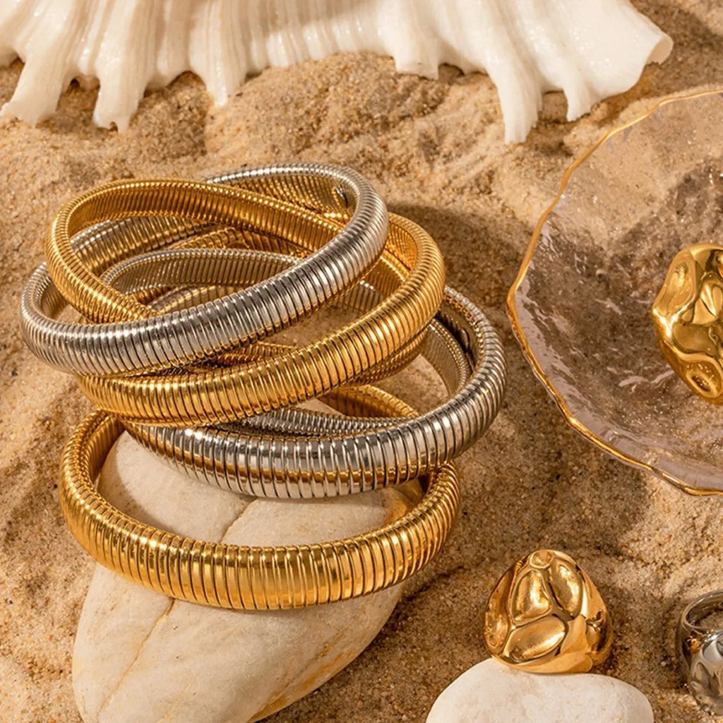 Women's gold elastic titanium steel bracelet with exaggerated vertical stripe ring pattern