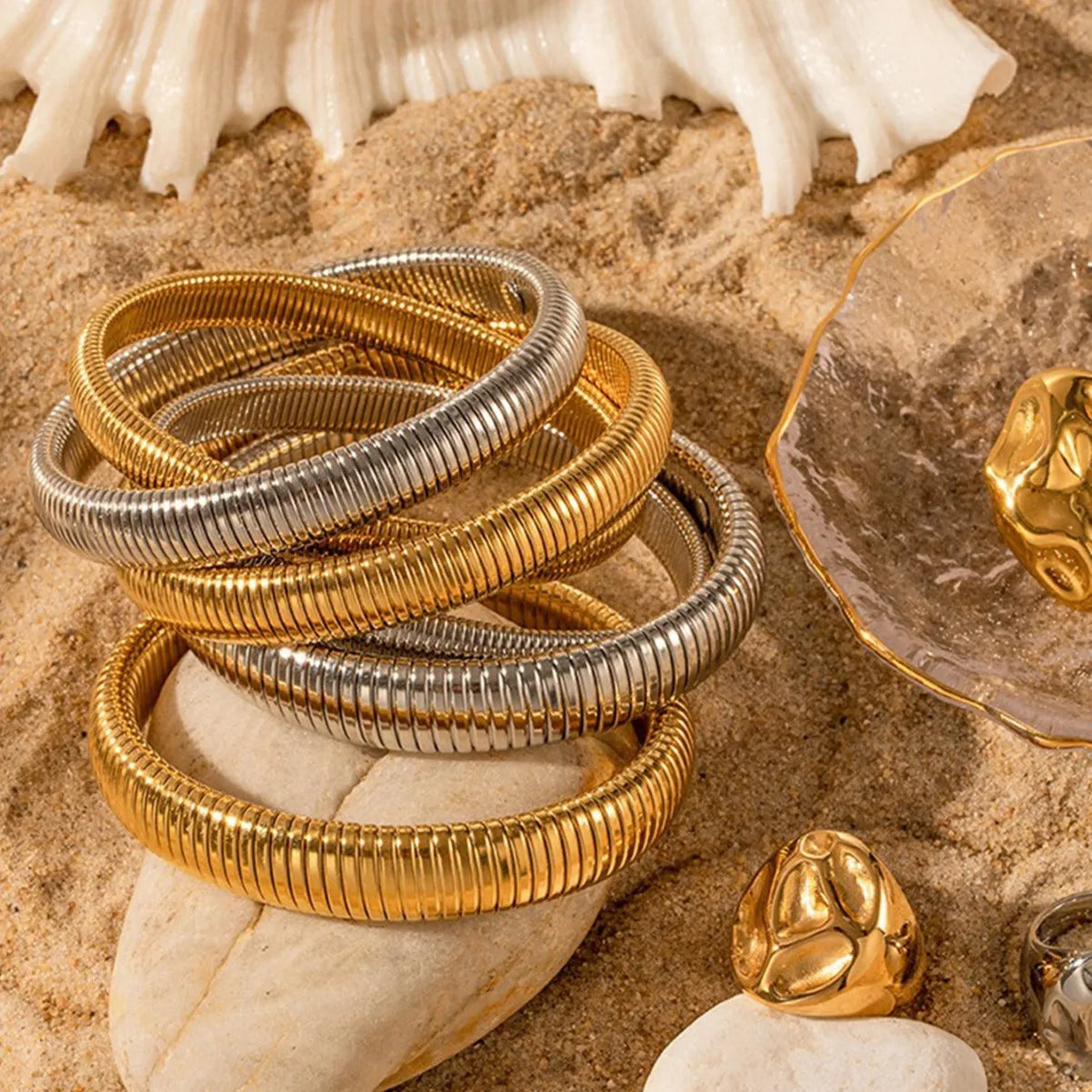 Women's gold elastic titanium steel bracelet with exaggerated vertical stripe ring pattern