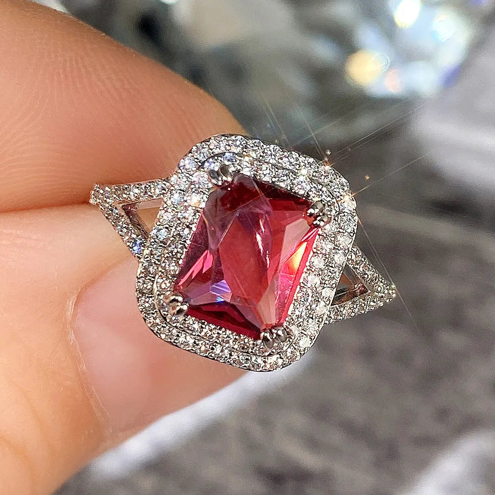 Copper women's ring with a square red rhinestone in a geometric setting.