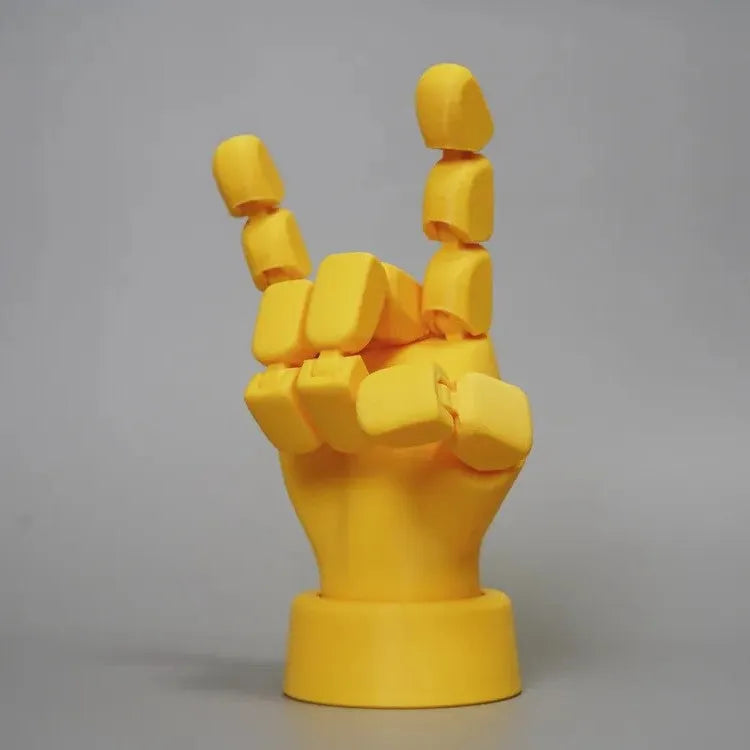Yellow 3D printed hand props with movable joints for photography and displays