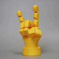 Yellow 3D printed hand props with movable joints for photography and displays